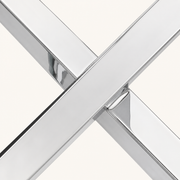 Macro | crossed stainless-steel legs meeting at the base