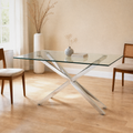 In a room | silver pedestal glass dining table in a pale flax dining room, bright midday light