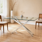 In a room | silver pedestal glass dining table in a pale flax dining room, bright midday light