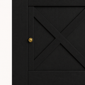 Hardware detail | close-up on one round brass-tone knob and the X-brace door front