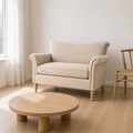 Angle | Stipanska loveseat three quarter view showing the rolled arm and turned wood leg