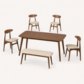 Angle | Strombolicchio set at a true three-quarter so the flared table legs and oval chair backs read