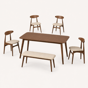 Angle | Strombolicchio set at a true three-quarter so the flared table legs and oval chair backs read