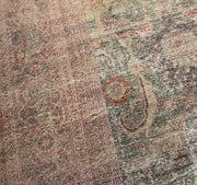 Texture | Close view of the low, faded pile and its floral drawing