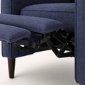 Mechanism detail | black metal scissor recline mechanism under the blue upholstered footrest