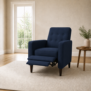 In scale | dark blue recliner with extended footrest beside a full-height doorway