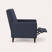 Studio side | left profile of dark blue recliner with extended footrest and visible scissor mechanism