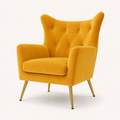 Three-quarter | mustard velvet wingback chair turned to show wing depth, side rail, and four gold legs