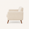 Side | Studio profile view of the square arm and splayed wood legs