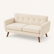 Studio | Three-quarter studio view of the tufted back, two seat cushions, and square arms