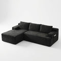 Front | Black corduroy sectional on a white studio backdrop with the chaise on the left