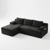 The Cloud Sectional in black corduroy, left hand facing, on white studio background