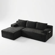Front | Black corduroy sectional on a white studio backdrop with the chaise on the left