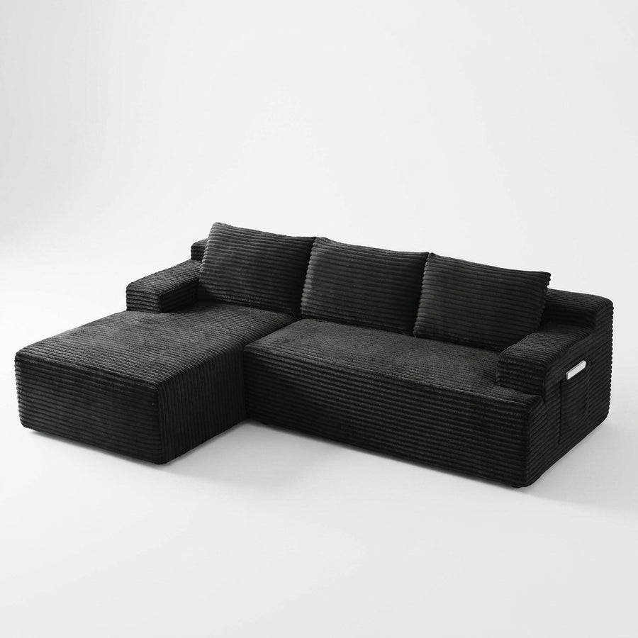 Front | Black corduroy sectional on a white studio backdrop with the chaise on the left