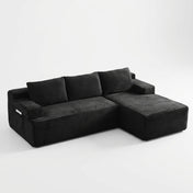 The Cloud Sectional in black corduroy, right hand facing, on white studio background