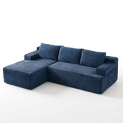 The Cloud Sectional in blue corduroy on white studio background