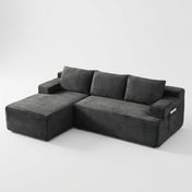 The Cloud Sectional in dark gray corduroy on white studio background