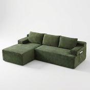 The Cloud Sectional in green corduroy on white studio background