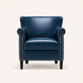 Studio front | Navy faux leather armchair with rolled arms and silver nailhead trim