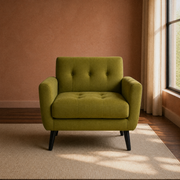 In a room | olive-green velvet tufted armchair in a terracotta room with dark walnut floor, right-side window, plain oatmeal rug and low cabinet