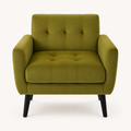 Front | front view of an olive-green velvet tufted armchair with square track arms, four-panel back and tapered black legs on a clean studio ground