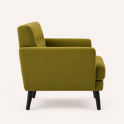Side | true side profile of an olive-green velvet armchair showing its upholstered back, seat depth, square arm and black tapered legs