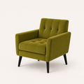 Studio | three-quarter studio view of an olive-green velvet armchair showing the tufted seat, square arms, side rail and tapered black legs