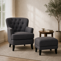 In a room | dark gray tufted armchair and matching ottoman in a warm chalk-plaster reading room