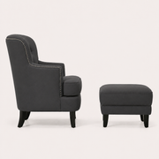 Side | side studio profile showing the chair back slope, arm, and matching ottoman