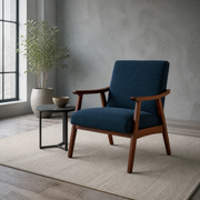 Room three | navy woven armchair in a cool greige room beside a blackened-steel side table