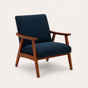 Studio three-quarter | navy woven armchair showing the open side frame, seat depth, and angled legs