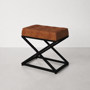 Side | rectangular saddle tan leather ottoman showing its 14-inch depth and black X-base profile