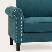 Nailhead detail | silver-toned nailhead trim along the blue-green rolled arm and boxed seat edge