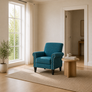 Scale | blue-green tweed armchair beside an uncropped floor-to-ceiling window and doorway