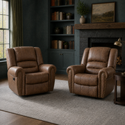 In a room | two Nut Brown nailhead recliners in a deep blue-green library with a dark stone fireplace