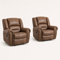 Angle | two matching Nut Brown recliners in three-quarter studio view with rolled arms, nailhead trim, side panels, and black levers