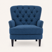 Front | straight-on studio view of the dark-blue upholstered chair with diamond tufted back and silver nailhead trim