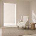 In scale | cream accent chair beside a full uncropped floor-to-ceiling doorway