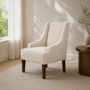 Living room three-quarter | cream chair from the opposite angle, with the full seat and tapered legs