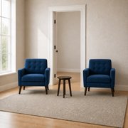In scale | two deep blue armchairs beside an uncropped interior doorway and tall window reveal for a true-size comparison