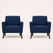 Studio front | two deep blue polyester plain-weave armchairs facing forward with six-button backs, flared arms, and espresso birch legs