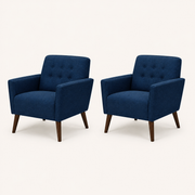 Studio angle | paired deep blue armchairs at a true three-quarter angle with side rails, flared arms, and tapered birch legs visible