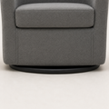 Hardware | close view of the low matte-black circular swivel base beneath the slate gray upholstered chair