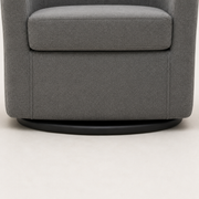 Hardware | close view of the low matte-black circular swivel base beneath the slate gray upholstered chair