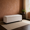 Room 2 | Ivory button-tufted storage bench at three-quarter in a terracotta room with a tall window, dark round table, plant, and plain rug