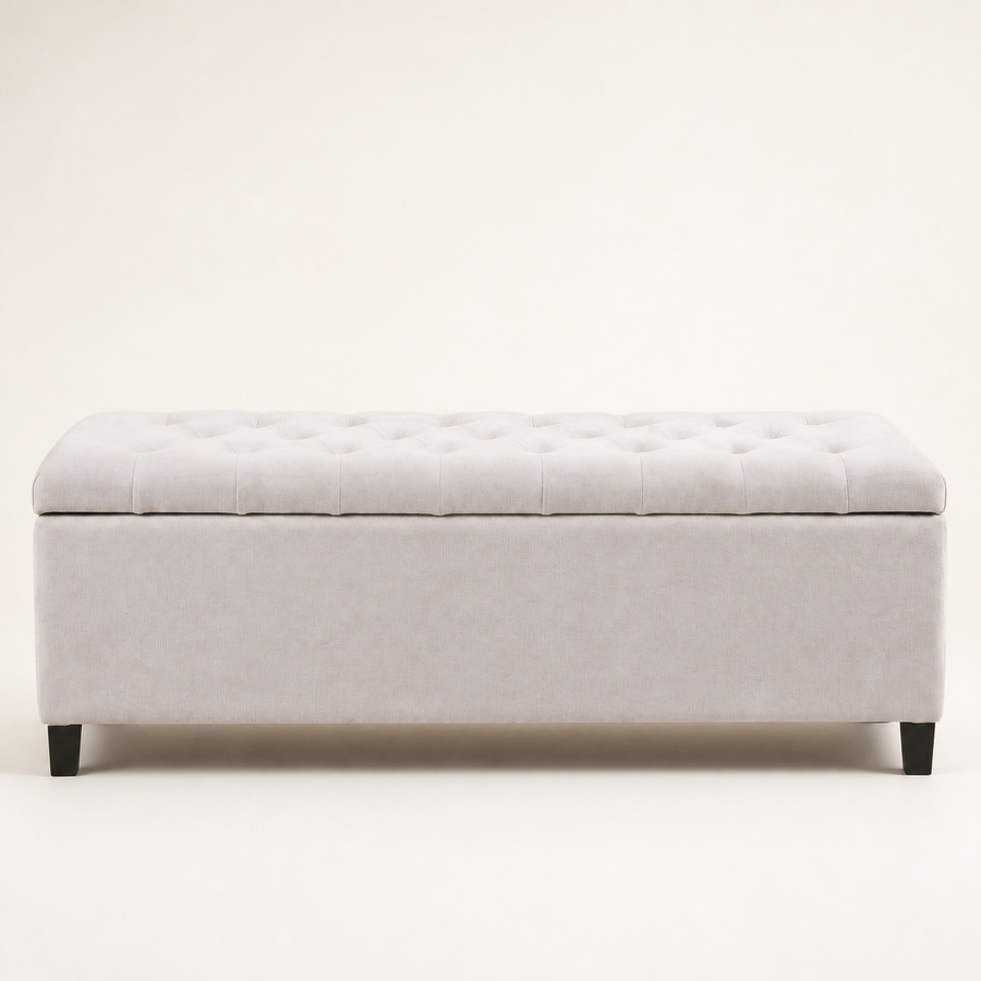 Front | Ivory button-tufted storage bench in clean front elevation on a warm off-white studio ground, with four dark wood block feet