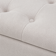 Texture | close view of ivory textured upholstery, deep tufting, stitching, and one covered button