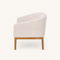 Side | right side studio profile showing the loveseat back curve, arm depth, and wood legs