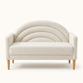 Front studio | Cream textured loveseat viewed straight on with a three-channel arched back, square arms, one bench seat, and tapered brown legs