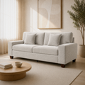 Room | Three-quarter view of the beige-gray compact sofa in the ivory living room with oak coffee table